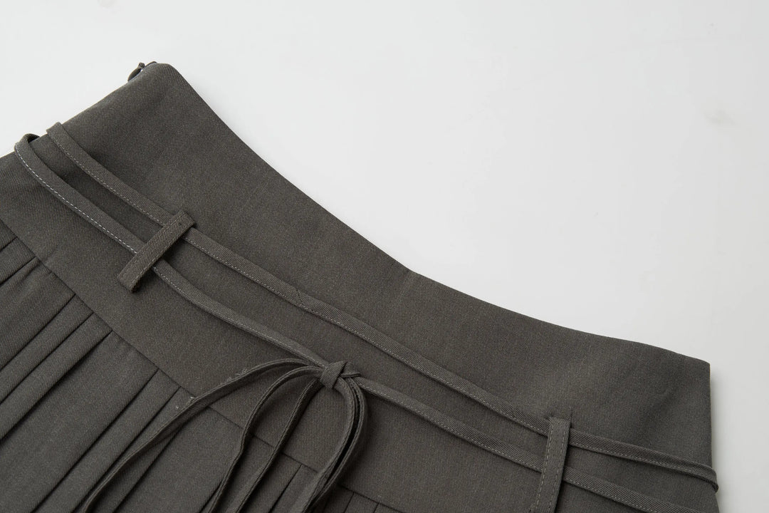 An image of a   32032 Pleated Mini Skirt with String Belts by  Mirra Masa