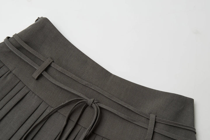 An image of a   32032 Pleated Mini Skirt with String Belts by  Mirra Masa