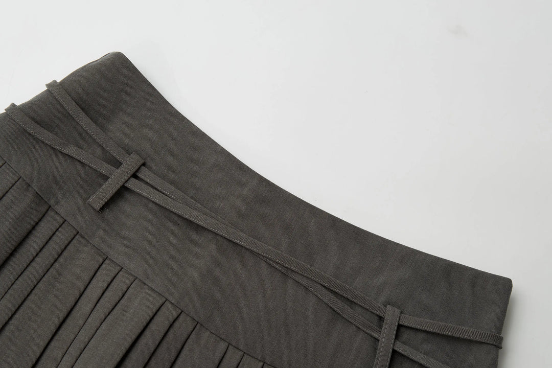 An image of a   32032 Pleated Mini Skirt with String Belts by  Mirra Masa