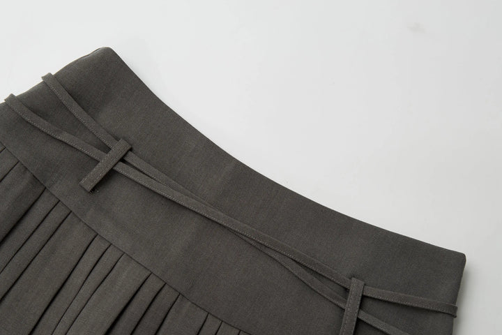 An image of a   32032 Pleated Mini Skirt with String Belts by  Mirra Masa