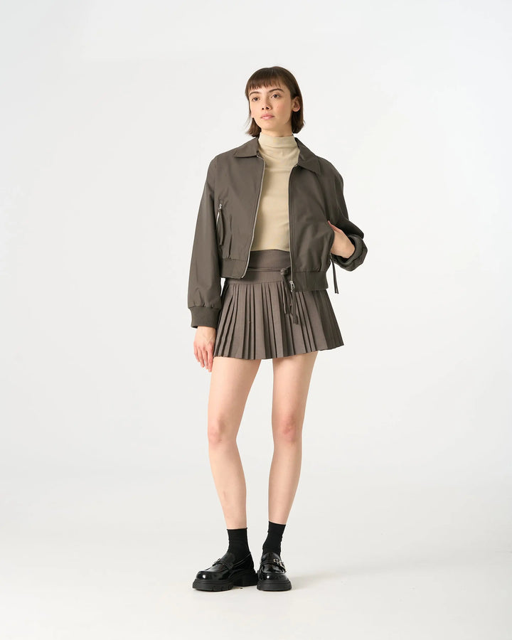 An image of a   32032 Pleated Mini Skirt with String Belts by  Mirra Masa
