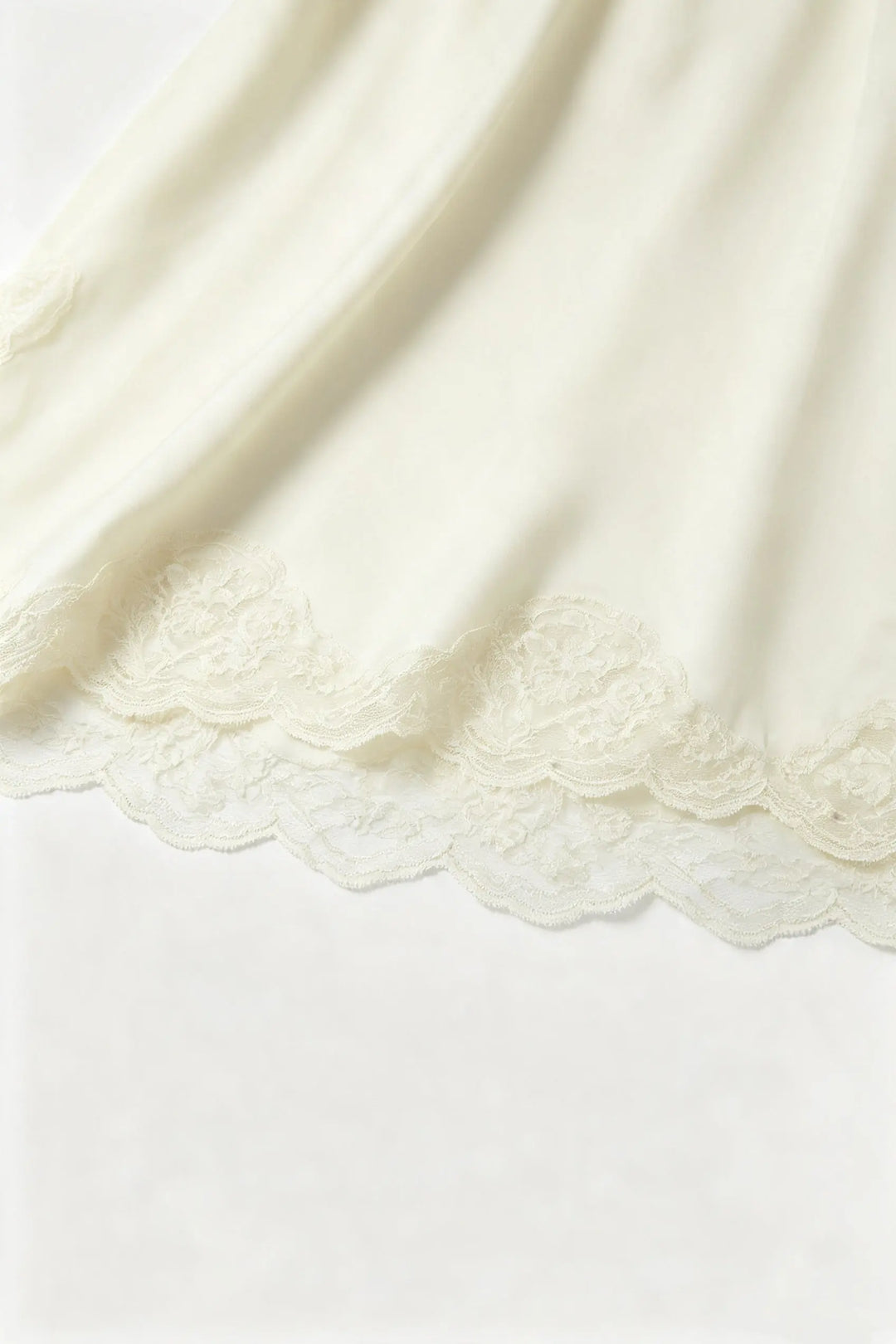 An image of a   33112 Lace Trim Slip Dress by  Mirra Masa