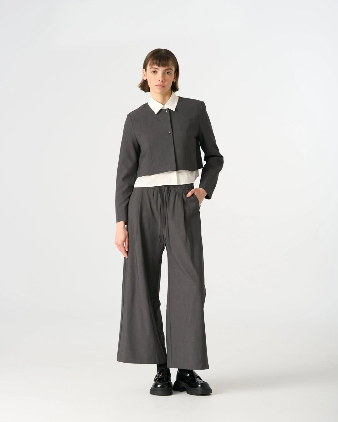 An image of a  Dark Grey / Medium 34549 Minimalist Two-Button Cropped Blazer by  Mirra Masa