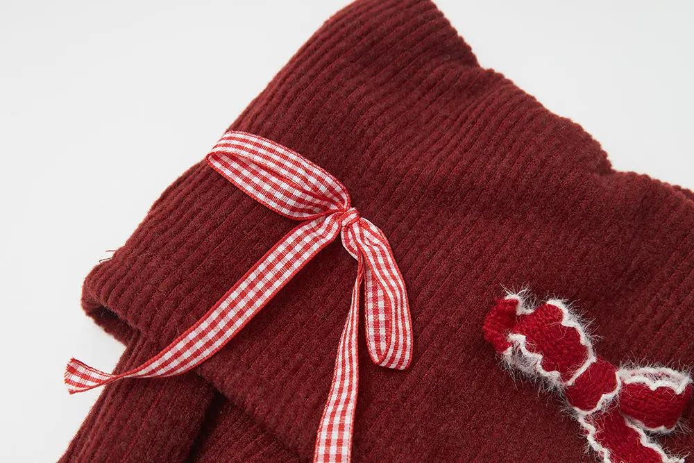 An image of a   41103 Holiday Bow Off Shoulder Top by  Mirra Masa