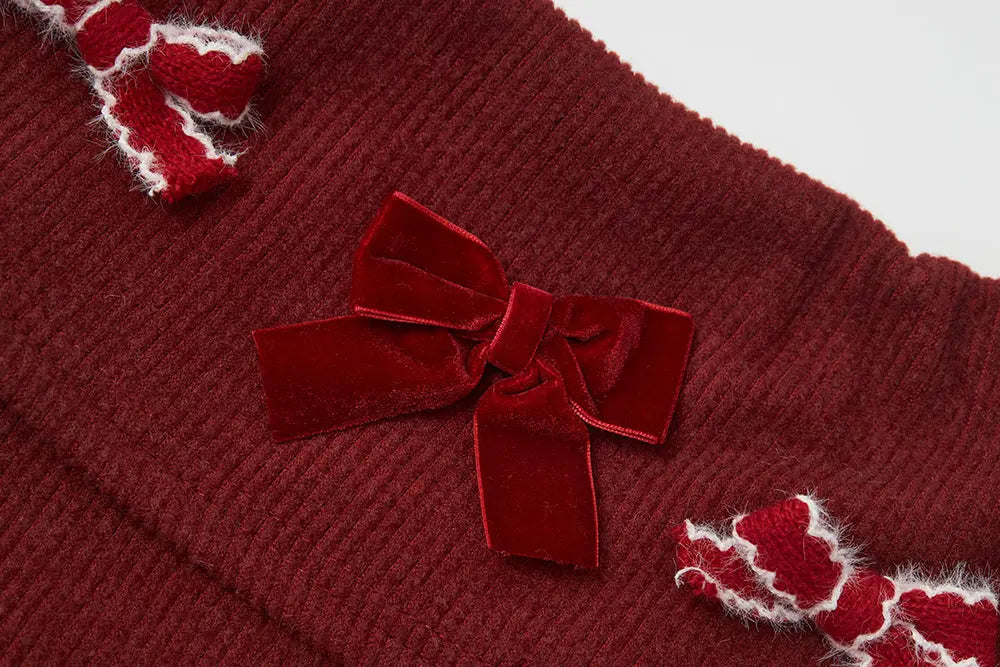 An image of a   41103 Holiday Bow Off Shoulder Top by  Mirra Masa