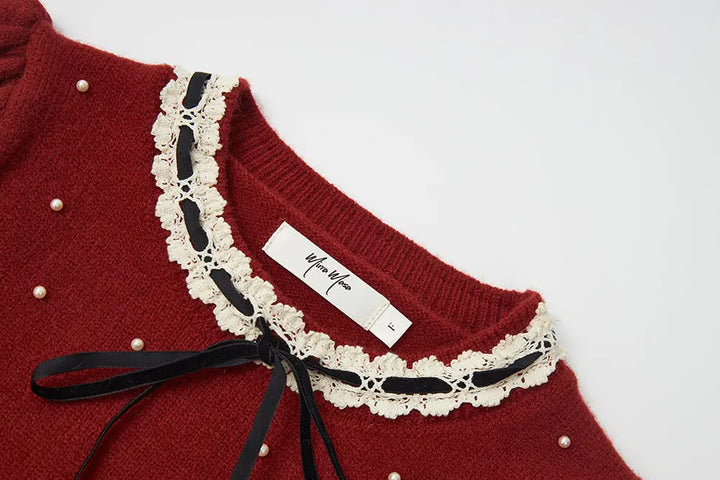 An image of a   41640 Round Neck Knit with Pearls & Bow by  Mirra Masa