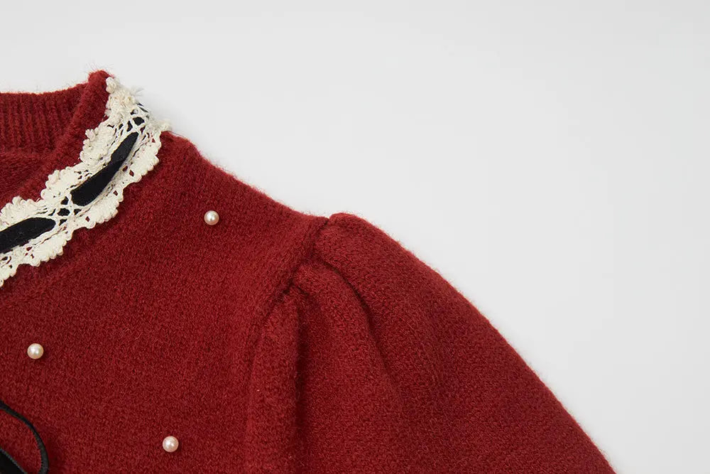 An image of a   41640 Round Neck Knit with Pearls & Bow by  Mirra Masa