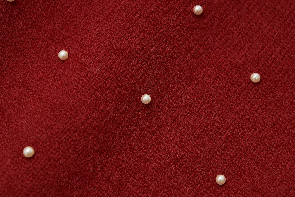 An image of a   41640 Round Neck Knit with Pearls & Bow by  Mirra Masa