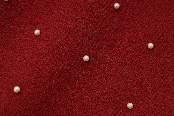 An image of a   41640 Round Neck Knit with Pearls & Bow by  Mirra Masa