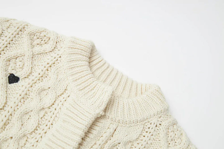 An image of a   41686 Hearty Trim Cable Knit Sweater by  Mirra Masa