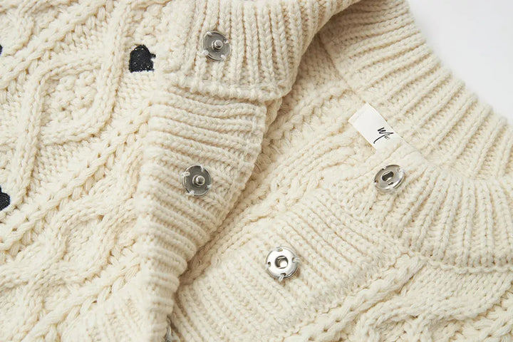 An image of a   41686 Hearty Trim Cable Knit Sweater by  Mirra Masa