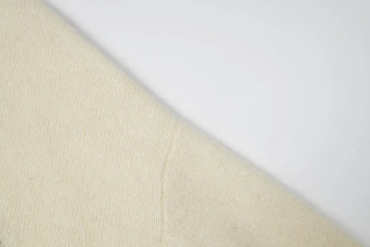 An image of a   41836 Crewneck Wool Sweater with Bow by  Mirra Masa