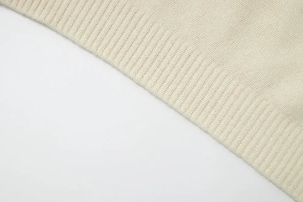 An image of a   41836 Crewneck Wool Sweater with Bow by  Mirra Masa