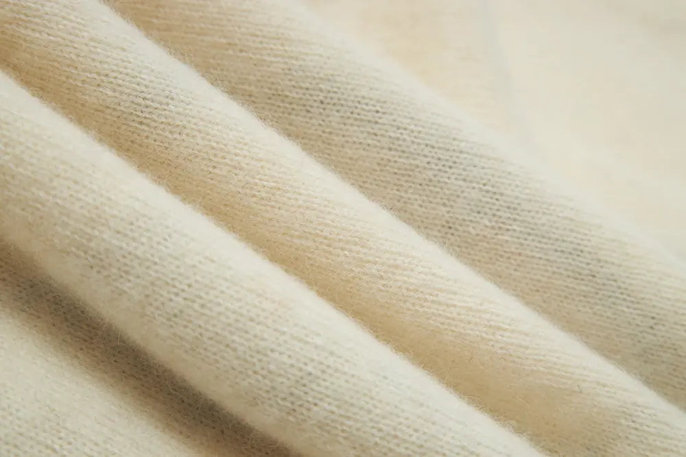 An image of a   41836 Crewneck Wool Sweater with Bow by  Mirra Masa