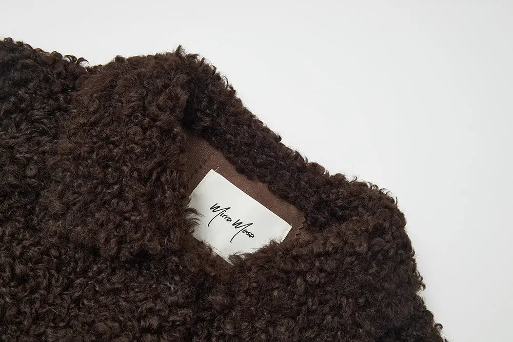 An image of a   44584 Women's Cropped Sherpa Jacket by  Mirra Masa