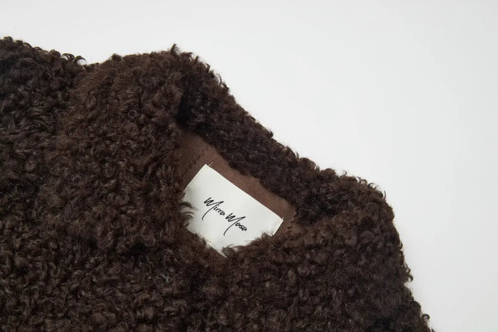 An image of a   44584 Women's Cropped Sherpa Jacket by  Mirra Masa