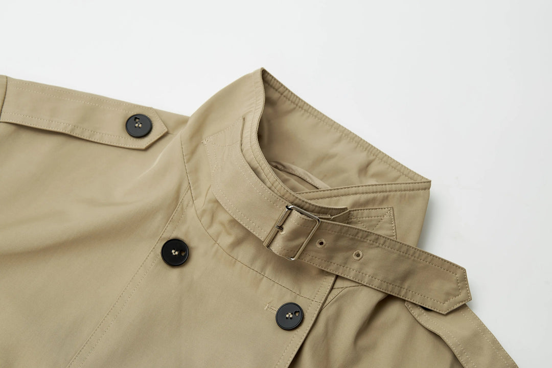 An image of a   A072 Short Trench Coat by  Mirra Masa