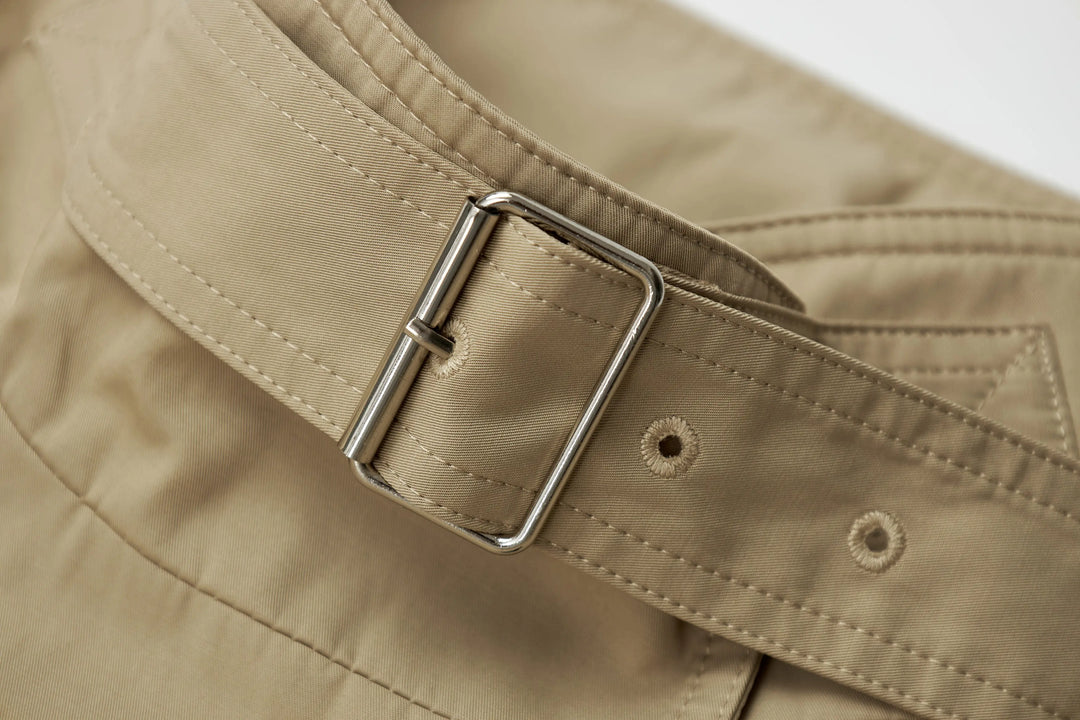 An image of a   A072 Short Trench Coat by  Mirra Masa