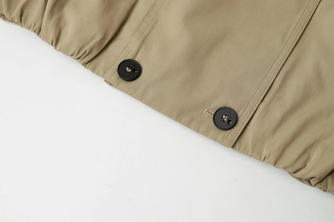 An image of a   A072 Short Trench Coat by  Mirra Masa