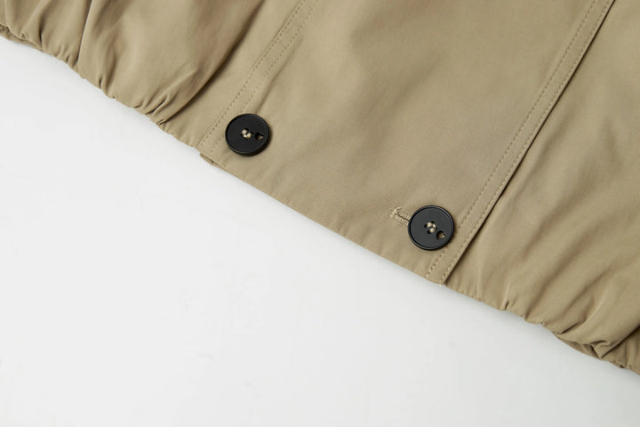 An image of a   A072 Short Trench Coat by  Mirra Masa