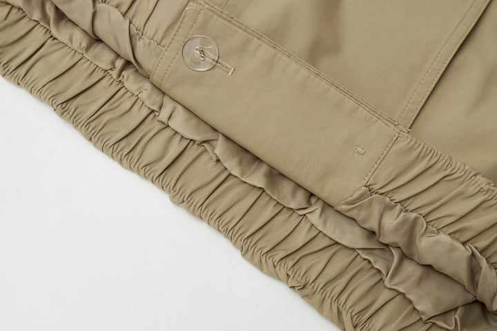 An image of a   A072 Short Trench Coat by  Mirra Masa