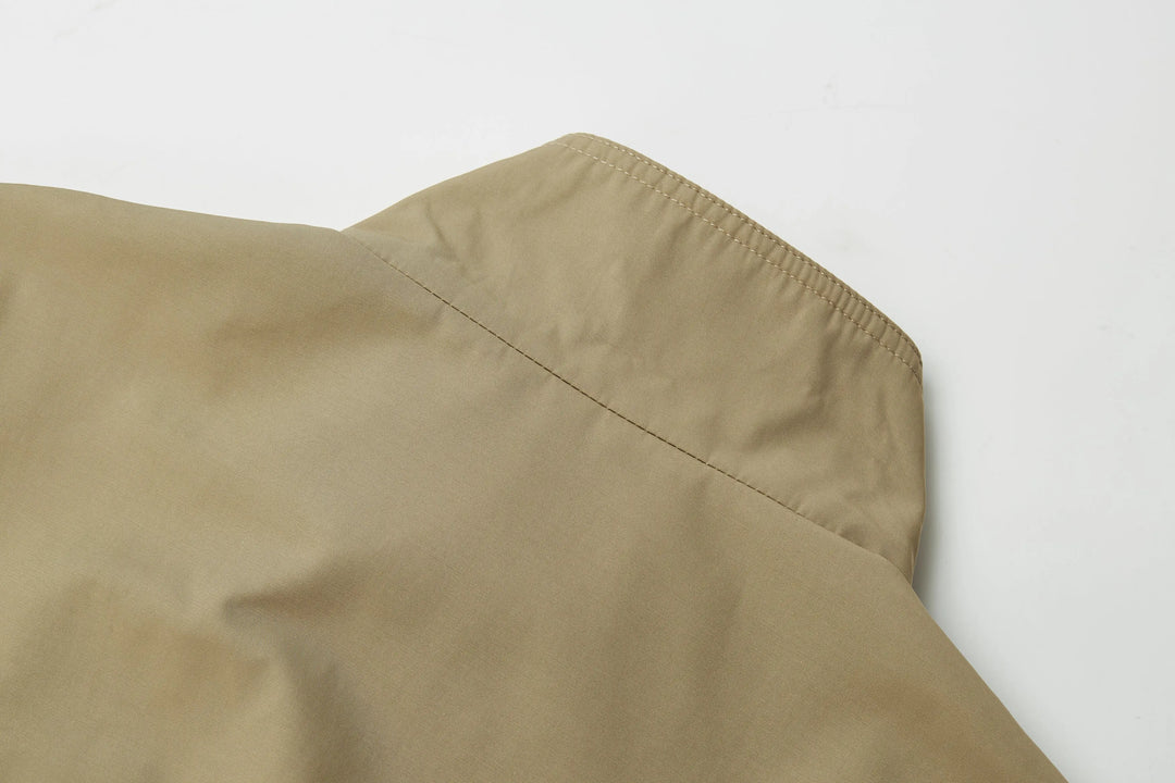 An image of a   A072 Short Trench Coat by  Mirra Masa