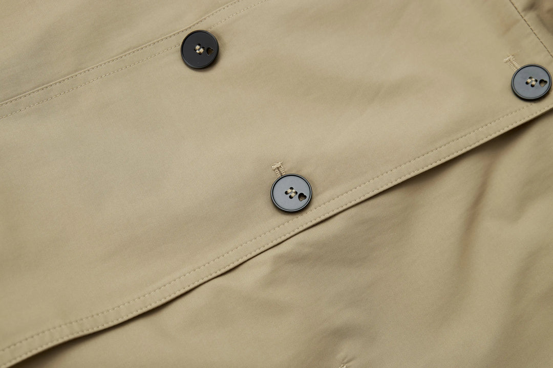 An image of a   A072 Short Trench Coat by  Mirra Masa
