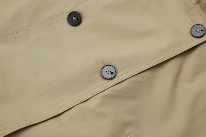 An image of a   A072 Short Trench Coat by  Mirra Masa