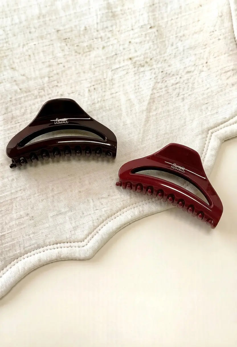 An image of a   Arched Cutout Hair Claw Large by  Mirra Masa