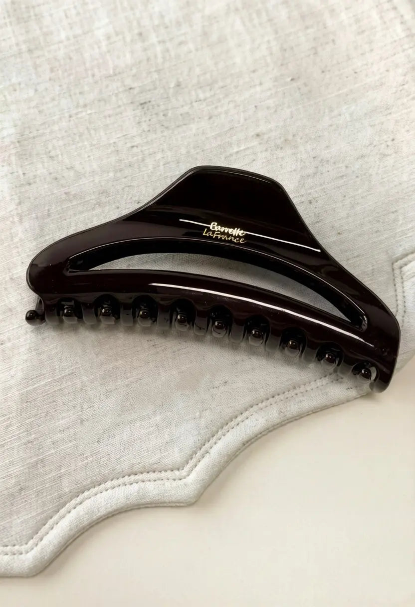 An image of a   Arched Cutout Hair Claw Large by  Mirra Masa