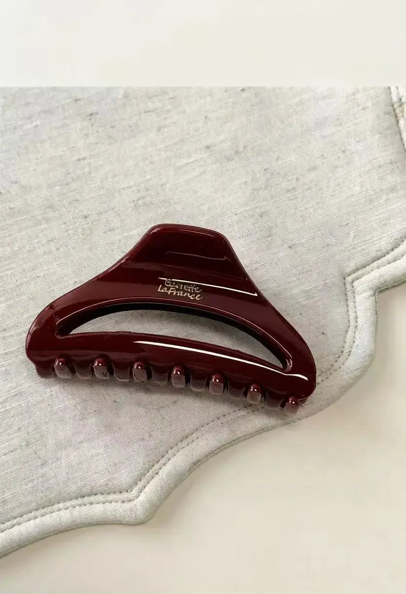 An image of a   Arched Cutout Hair Claw Small by  Mirra Masa