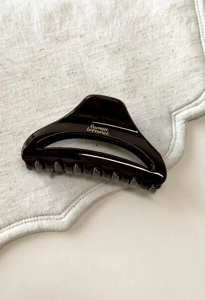 An image of a   Arched Cutout Hair Claw Small by  Mirra Masa
