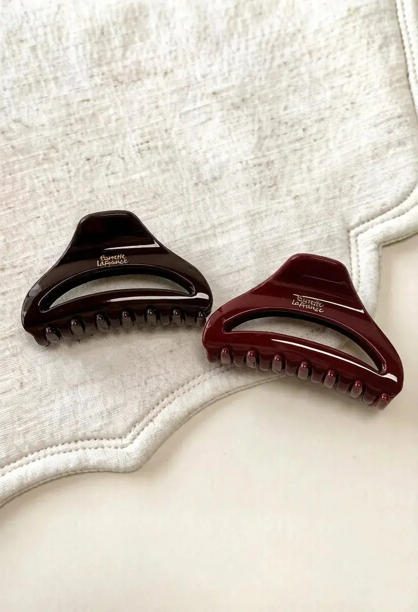 An image of a   Arched Cutout Hair Claw Small by  Mirra Masa