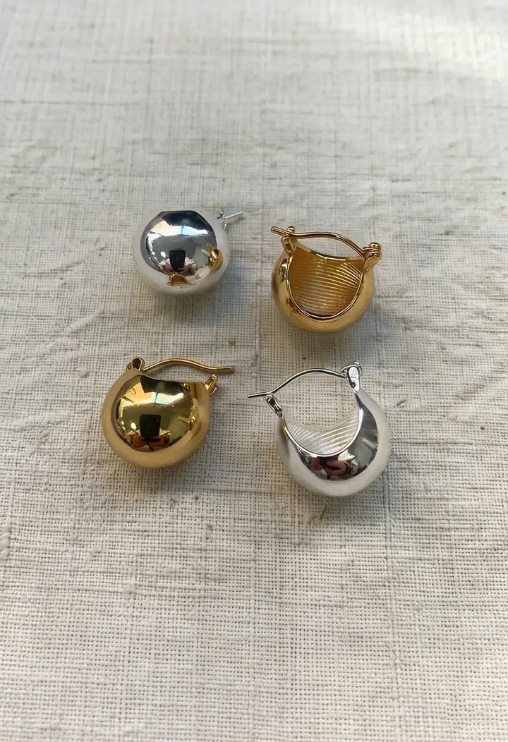 An image of a   Chunky Teardrop Hoop Earrings by  Mirra Masa