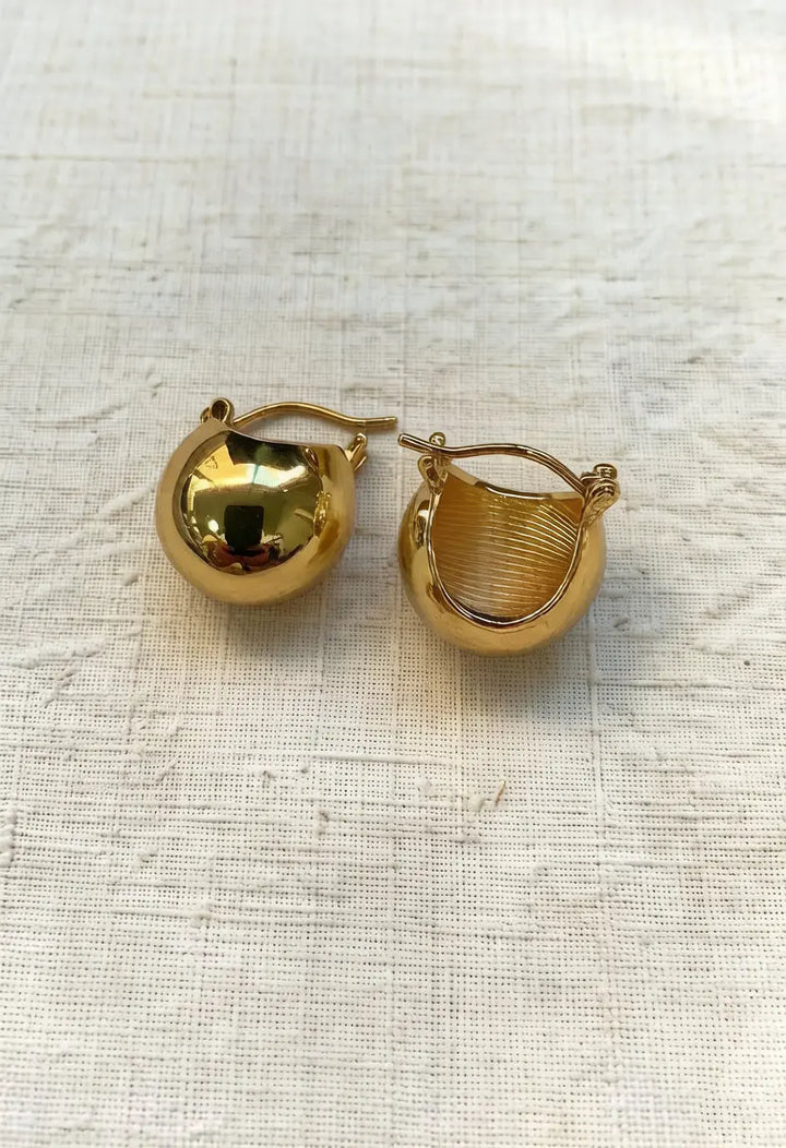 An image of a   Chunky Teardrop Hoop Earrings by  Mirra Masa
