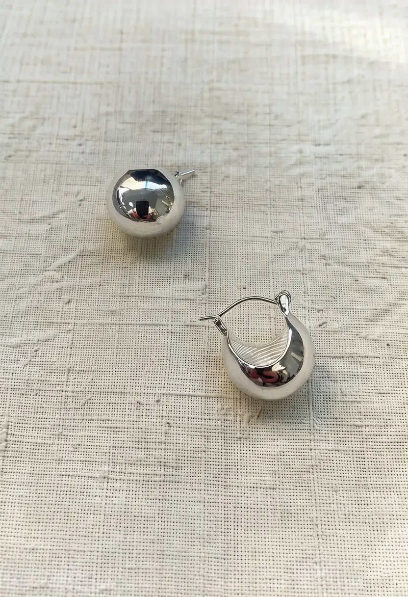 An image of a   Chunky Teardrop Hoop Earrings by  Mirra Masa