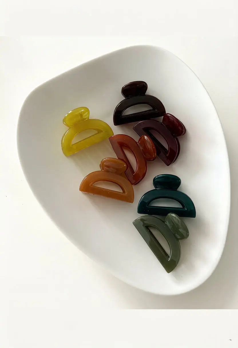 An image of a   Cutout Half-Moon Hair Claw Small by  Mirra Masa