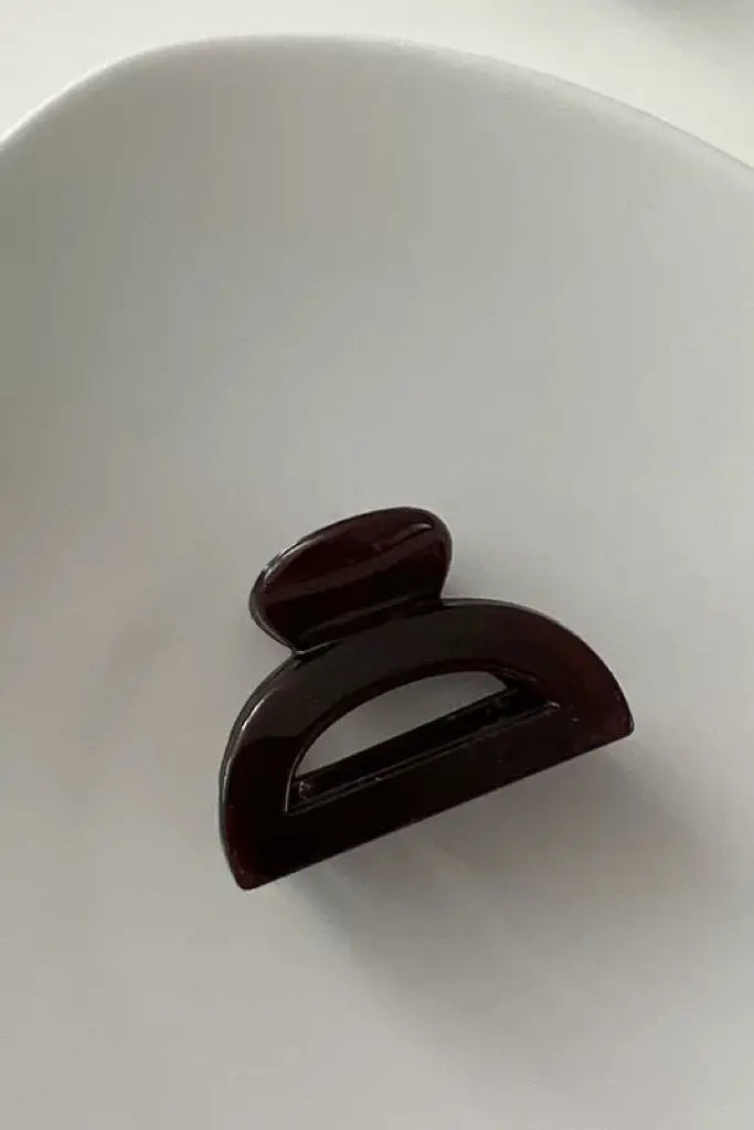 An image of a   Cutout Half-Moon Hair Claw Small by  Mirra Masa