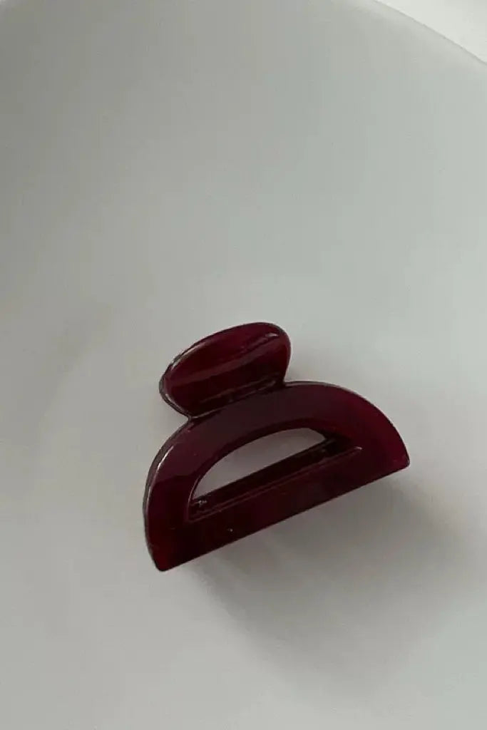 An image of a   Cutout Half-Moon Hair Claw Small by  Mirra Masa