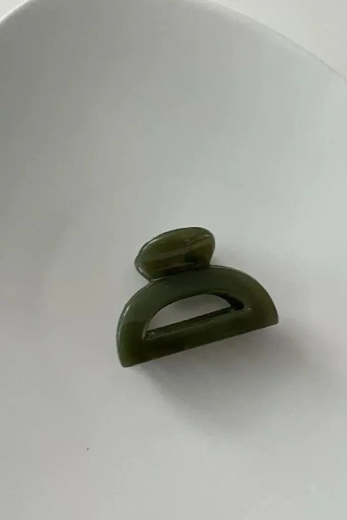 An image of a   Cutout Half-Moon Hair Claw Small by  Mirra Masa