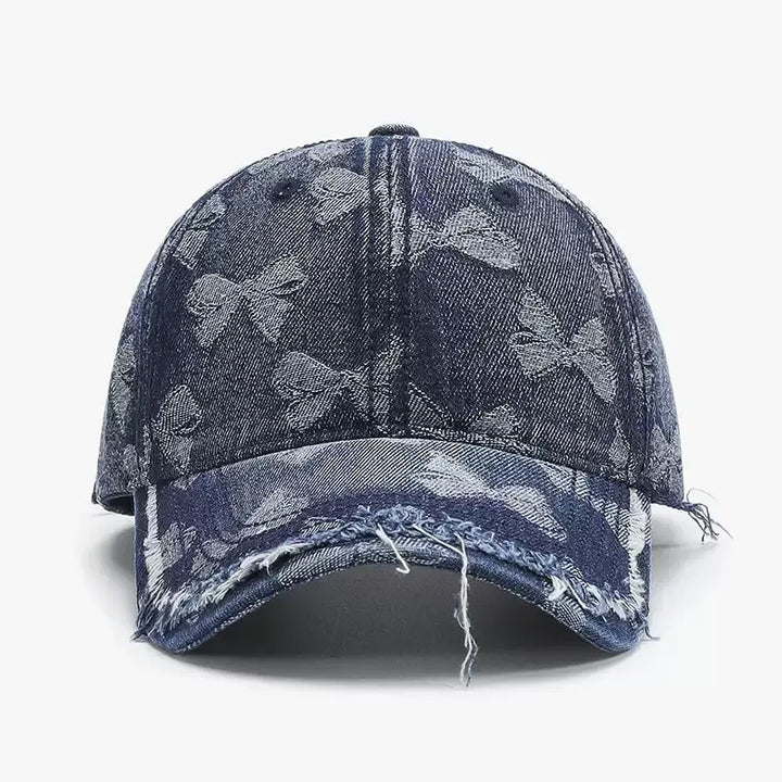 An image of a   Distressed Bow Denim Cap by  Mirra Masa