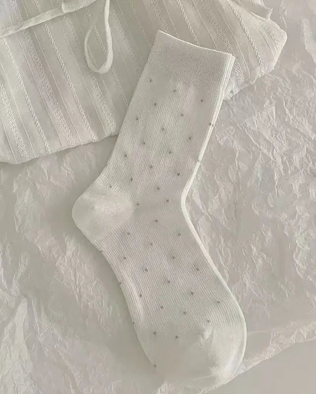 An image of a   Essential Pin-Dot Socks by  Mirra Masa