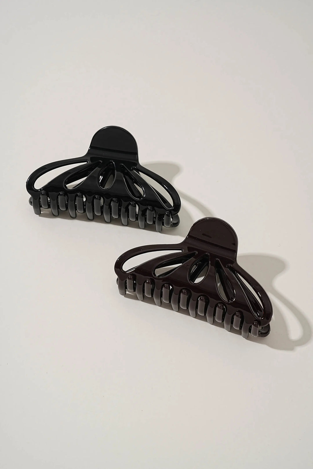 An image of a   Fan Glossy Cutout Hair Claws by  Mirra Masa