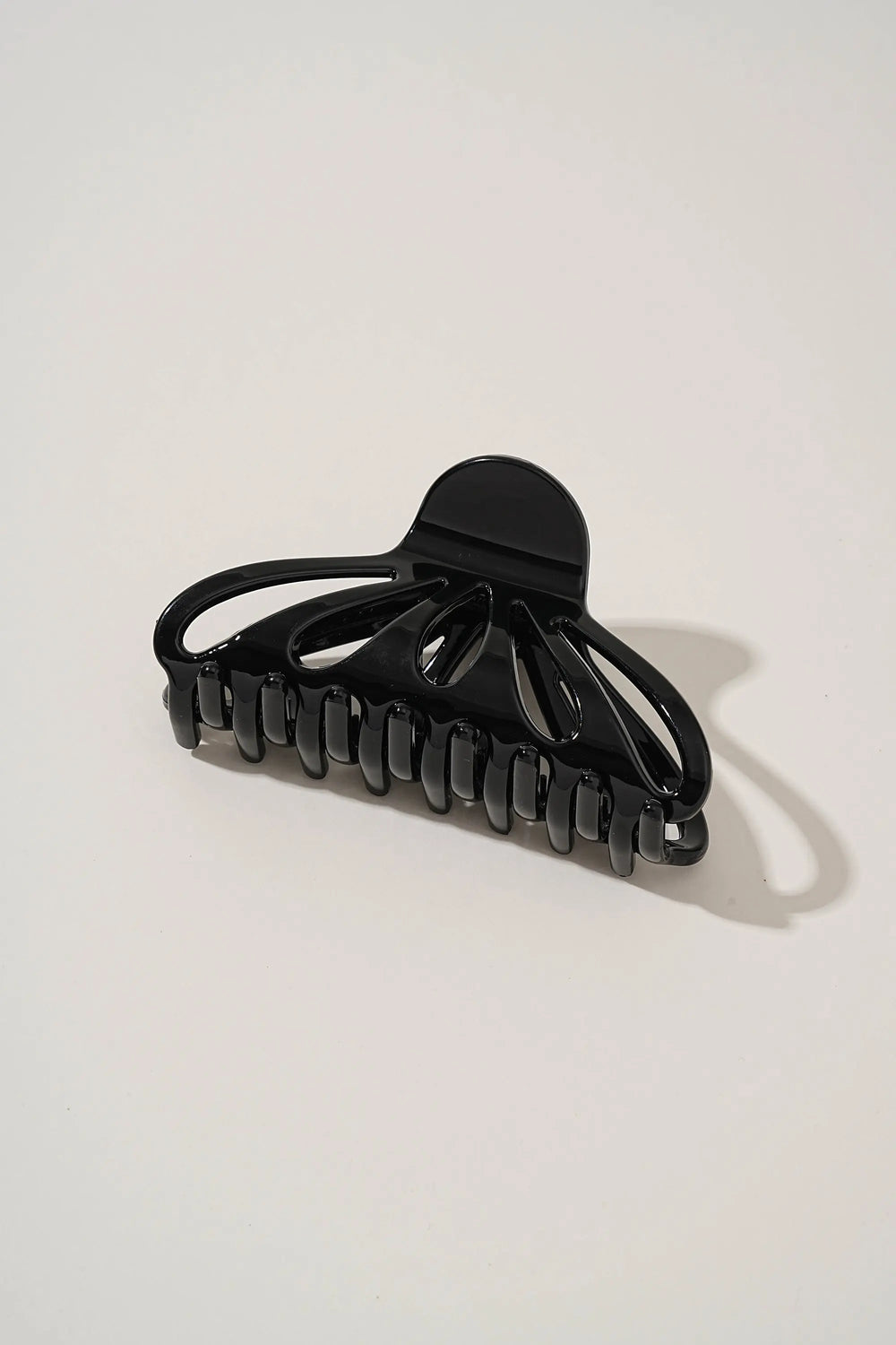 An image of a   Fan Glossy Cutout Hair Claws by  Mirra Masa