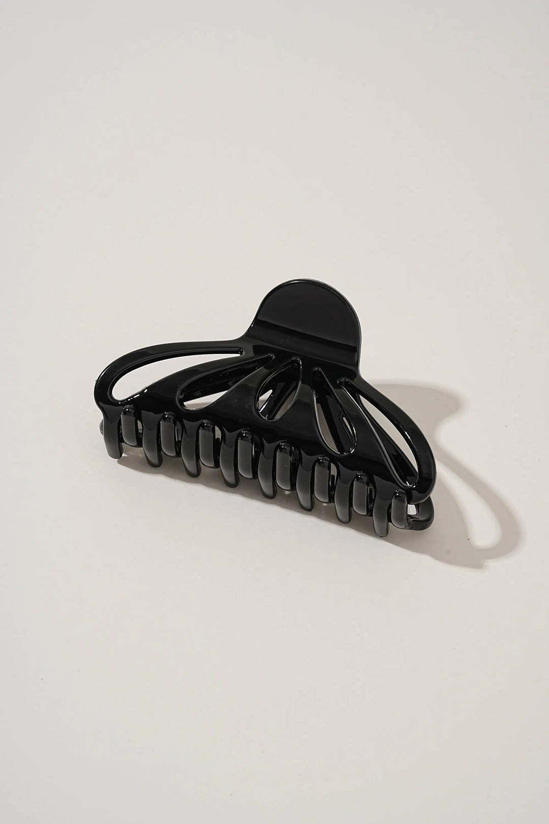 An image of a   Fan Glossy Cutout Hair Claws by  Mirra Masa