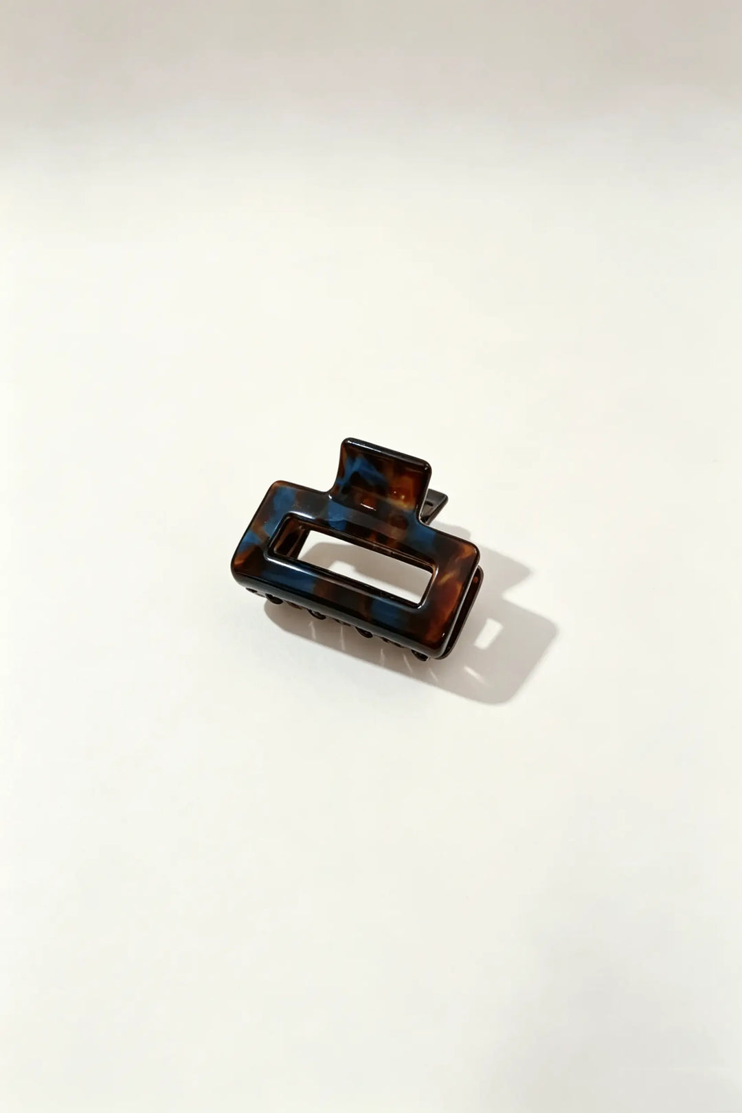 An image of a   Geo Glossy Classic Hair Claws by  Mirra Masa