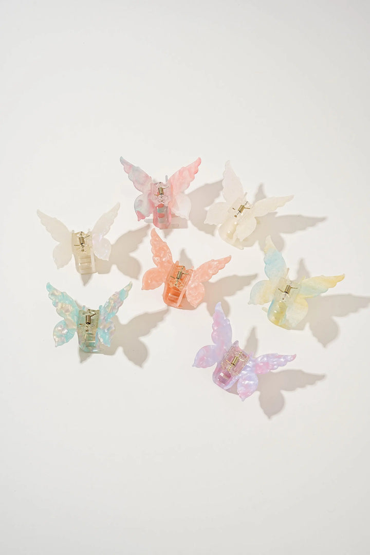 An image of a   Glossy Marbled Butterfly Hair Claw by  Mirra Masa