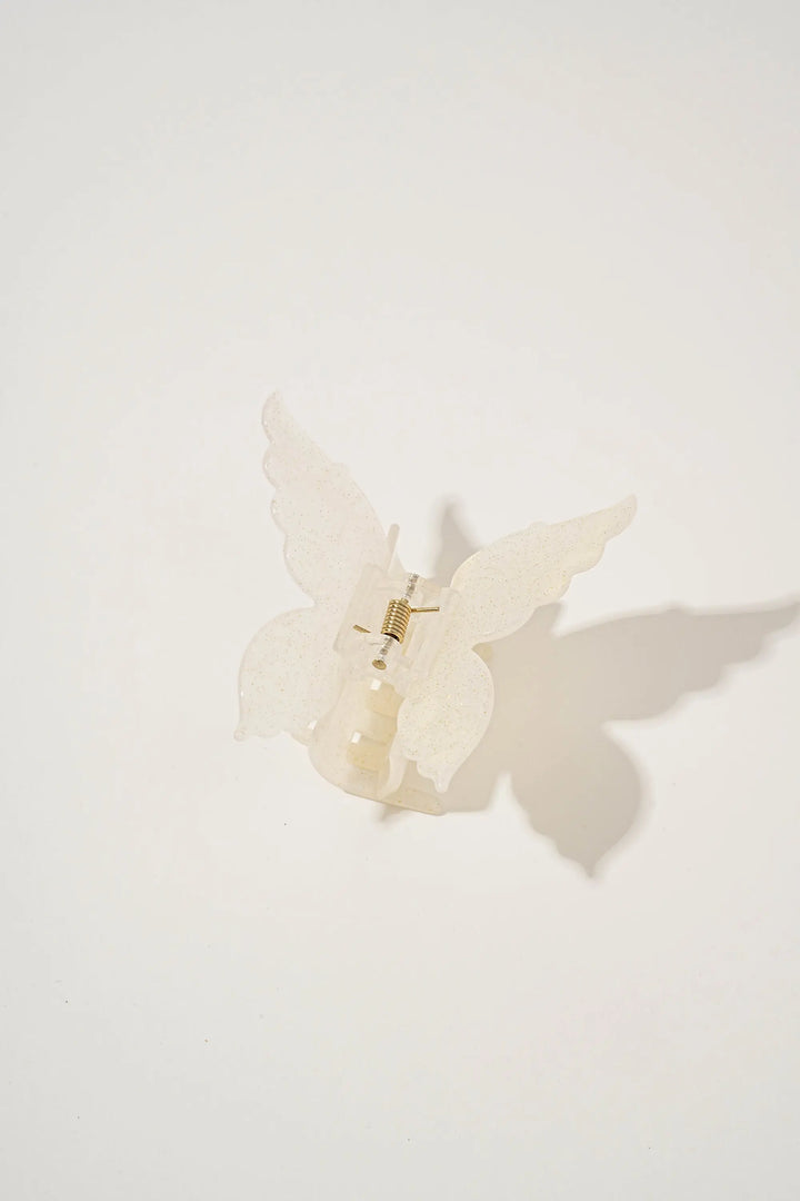 An image of a   Glossy Marbled Butterfly Hair Claw by  Mirra Masa