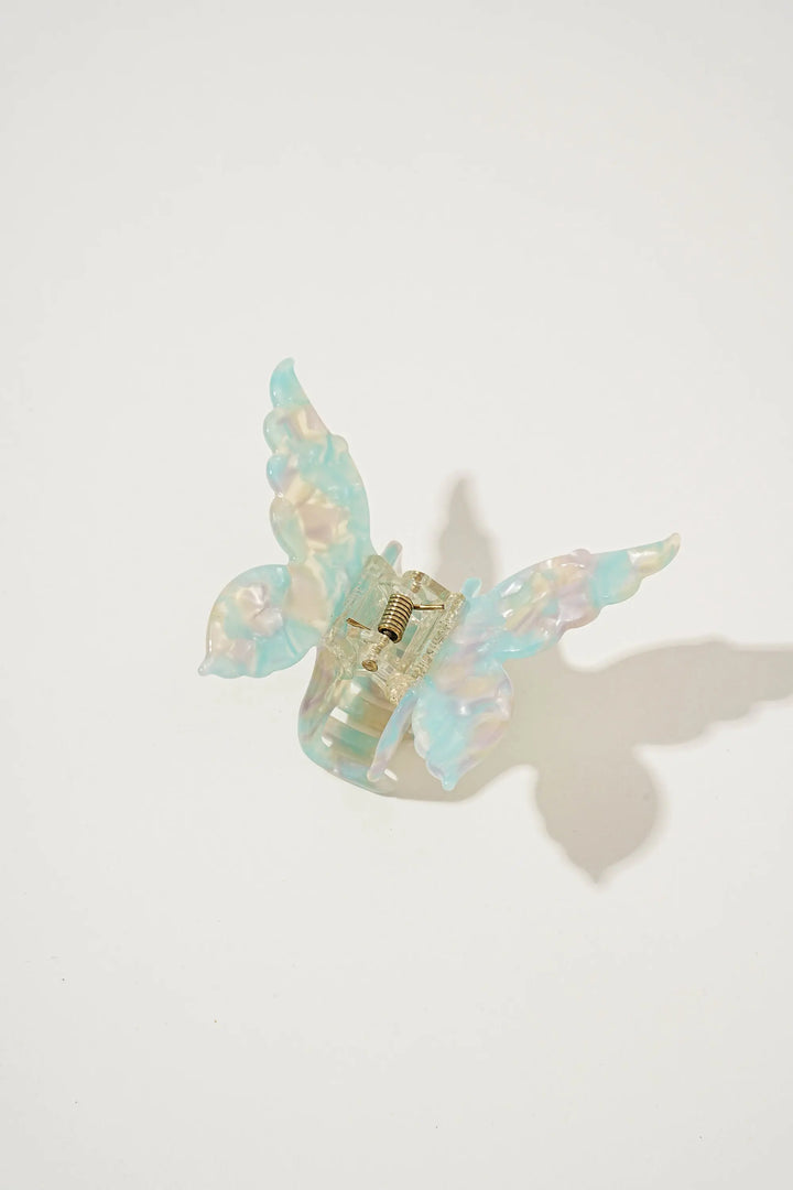 An image of a   Glossy Marbled Butterfly Hair Claw by  Mirra Masa