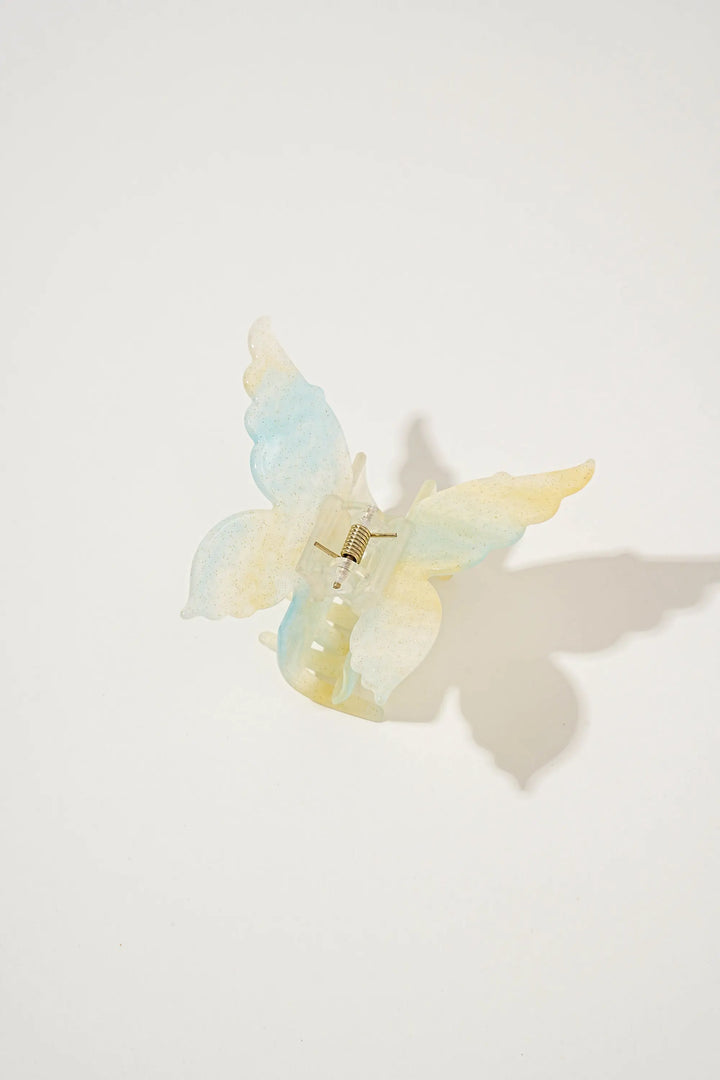 An image of a   Glossy Marbled Butterfly Hair Claw by  Mirra Masa